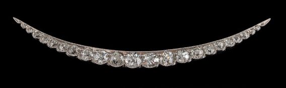 A diamond crescent brooch,