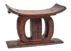A substantial Ashanti carved wood prestige stool, early 20th century,