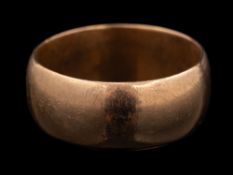 A 9 carat gold ring,: the plain polished band stamped 375 with full Birmingham hallmarks,