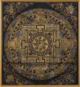 A Far Eastern thanka: of traditional design painted in gold and silver coloured paint to a black