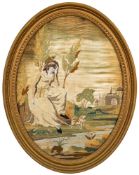 A Regency silkwork oval picture: depicting a young lady with her dog seated beside a castle stream,