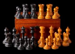 A boxwood and ebony Staunton pattern chess set: with weighted bases, the king 8cm, the pawn 5cm,