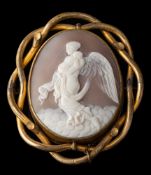 A shell cameo brooch,: the oval shell cameo carved with Nyx, collet set with an openwork surround,