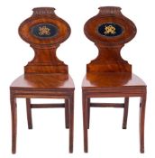 A pair of Regency mahogany hall chairs:,