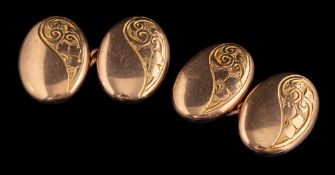 A pair of 9 carat gold cufflinks,: the double sided oval panel cufflinks with foliate engraving,