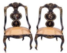 A pair of Victorian black lacquer and decorated occasional chairs:,