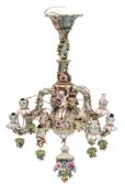 A German porcelain six-branch chandelier in the Meissen manner: applied and moulded with cherubs,