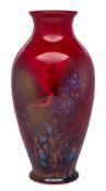 A Royal Doulton 'Sung' flambe baluster vase and a Royal Doulton flambe bowl: the vase with an
