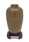 A Chinese teadust glazed vase: of ovoid form with everted rim, Qing Dynasty, 13cm wood stand.