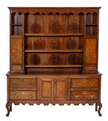 An early 19th Century oak, crossbanded and inlaid dresser:,