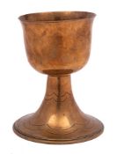 An Arts and Crafts influence gilt brass goblet: the plain bowl raised on an inverted flared