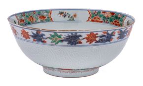 A Chinese verte-imari and incised bowl: the interior painted with a medallion of a jardiniere of