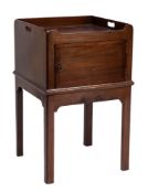 A George III mahogany adapted square tray top bedside cupboard:, with carrying handles to the sides,