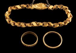 A 22 carat gold ring,: the polished band of plain design,