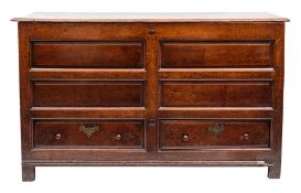 An 18th Century oak dower chest:, with a rectangular hinged moulded top,
