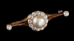 An early 20th century pearl and diamond brooch,: the 9.
