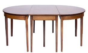An early 19th Century mahogany D-end dining table:, in three parts,