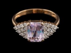 A kunzite and diamond ring:,