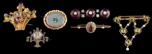 Six various brooches:- comprising ;- a peridot and seed pearl brooch,