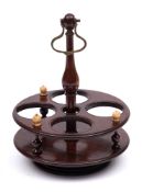 A 19th century treen condiment stand: of circular outline,