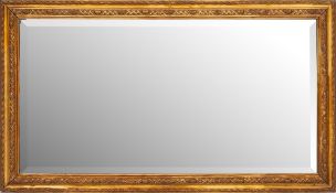 A rectangular giltwood and gesso mirror:, the plate in paterae, lattice and ovule frame,