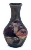 A small William Moorcroft 'Claremont' bottle vase: tube-lined and decorated with a continuous
