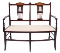 An Edwarian stained beech and inlaid three piece chair back salon suite,