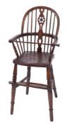 A child's early 19th Century elm, ash and beech Windsor wheel and stick back high chair:,