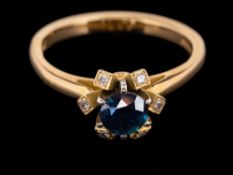 An 18 carat gold sapphire and diamond ring,