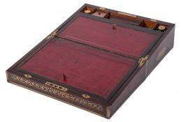 A Victorian rosewood and brass inlaid writing slope: the hinged lid enclosing a tooled leather