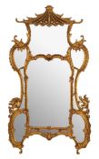 A contemporary gilt framed mirror in the Chinese Chippendale manner: the central arched panel and