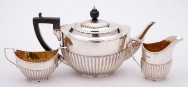 A George V silver three-piece tea service, maker William Hutton & Sons Ltd, Sheffield,