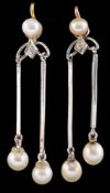 A pair of pearl and diamond ear pendants,: the pear drops suspended below polished bars,