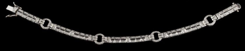 A diamond bracelet,: the articulated bracelet composed of rectangular panels and hooped links,