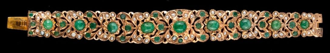 An emerald and pearl bracelet,: the tapered bracelet set with cabochon and circular cut emeralds,
