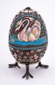 A late 20th century silver gilt and champlevé enamel Easter egg in the Imperial Russian style: