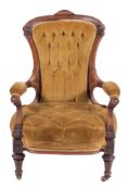 A Victorian carved walnut and button upholstered armchair in Aesthetic Movement taste, circa 1880,