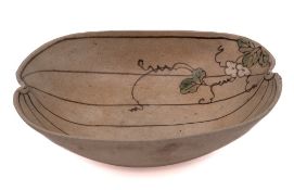 A Japanese earthenware 'gourd' bowl: decorated with a flowering leafy stem and veining,
