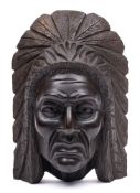 A carved wood mask depicting the native North American Shawnee chief Techmseh: 34cm. high.
