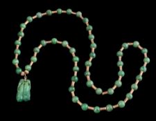 A carved jadeite pendant,: carved in the form of two pea pods approximately 3cm long,