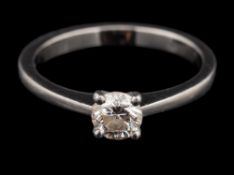 A platinum and diamond ring,: the brilliant cut diamond estimated to weigh 0.