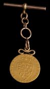 A George III gold spade guinea,: 1791, with a pendant fitting and t-bar.