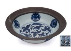 A Chinese blue and white bowl: with flared pewter-mounted rim,