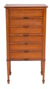 An Edwardian satinwood and inlaid filing cabinet:, decorated with lines,