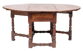 WITHDRAWN LOT A late 17th Century oak gateleg dining table:, with an oval hinged top,