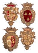 A set of four raised-work embroidered armorials: of oval and shield shaped outlines surmounted with