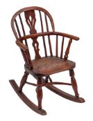 A yew wood and elm child's Windsor rocking chair, second quarter 19th century and later adapted,
