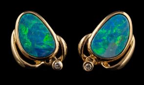 A pair of boulder opal and diamond earrings,: the oval shaped boulder opals in collet settings,