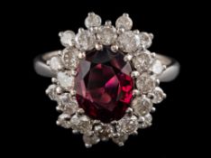 A garnet and diamond cluster ring:,