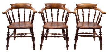 A set of six Victorian oak, elm and beech spindleback tub elbow chairs, mid 19th century,